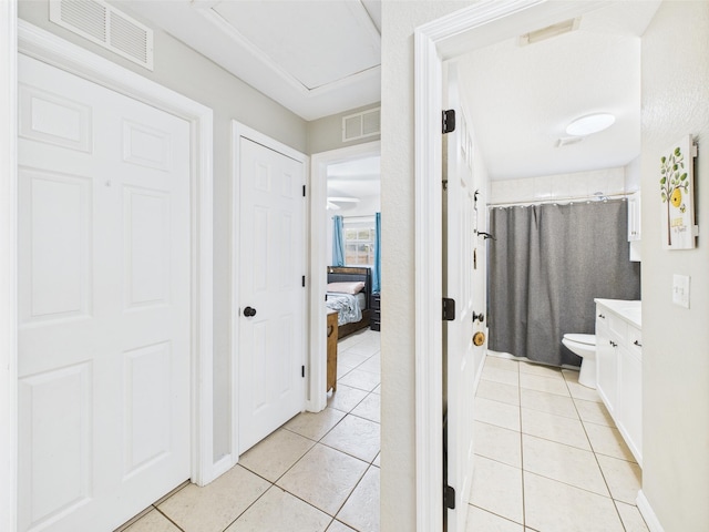 3307 SW 22nd St, Okeechobee, FL 34974 - bathroom featuring tile patterned flooring, vanity, toilet, and a shower with shower curtain