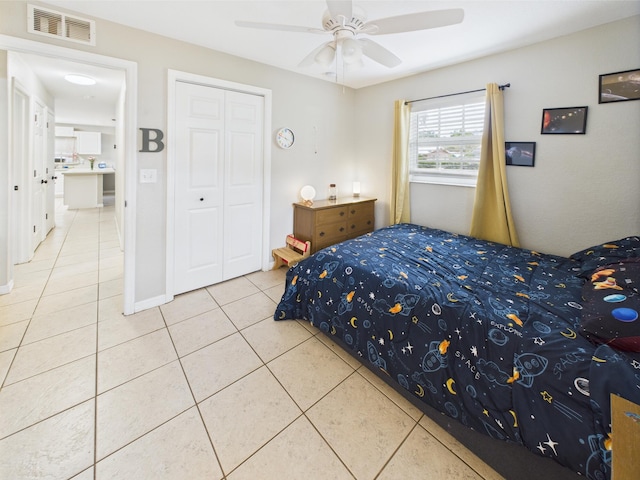 3307 SW 22nd St, Okeechobee, FL 34974 - tiled bedroom featuring a closet, a ceiling fan, and baseboards