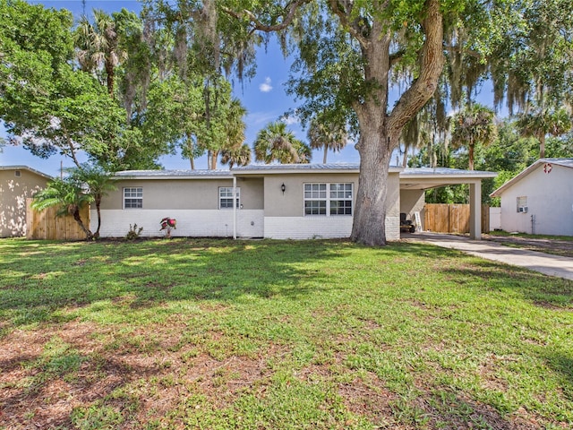 3307 SW 22nd St, Okeechobee, FL 34974 - single story home featuring brick siding, concrete driveway, a carport, and stucco siding