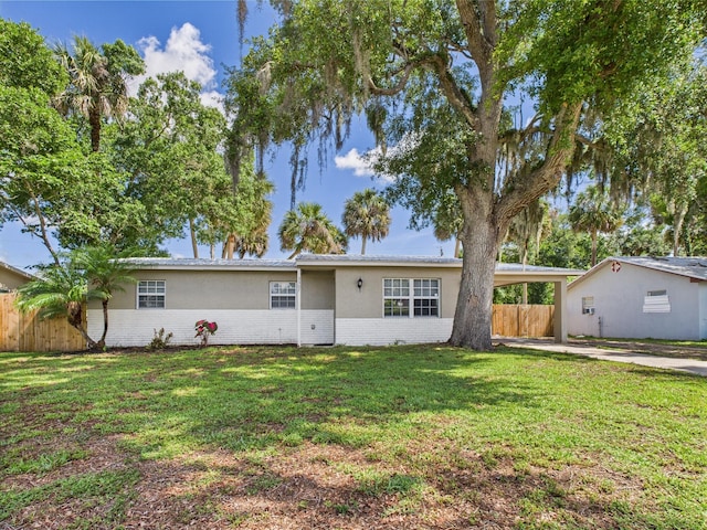 3307 SW 22nd St, Okeechobee, FL 34974 - ranch-style home featuring brick siding, an attached carport, driveway, and stucco siding