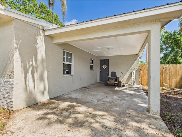 3307 SW 22nd St, Okeechobee, FL 34974 - view of patio featuring fence and a carport