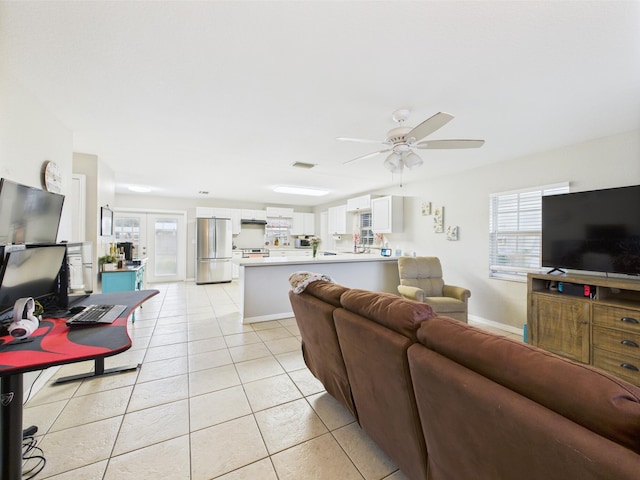3307 SW 22nd St, Okeechobee, FL 34974 - living area with a ceiling fan, light tile patterned floors, healthy amount of natural light, and baseboards