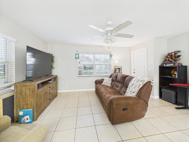 3307 SW 22nd St, Okeechobee, FL 34974 - living room featuring a ceiling fan, light tile patterned floors, and baseboards