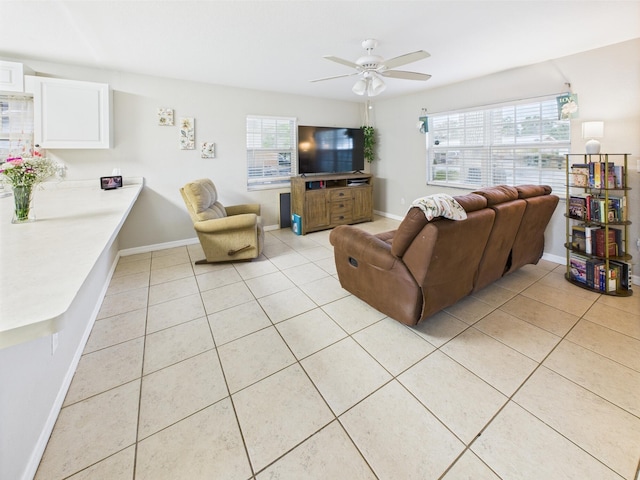 3307 SW 22nd St, Okeechobee, FL 34974 - living room with light tile patterned flooring, ceiling fan, and baseboards