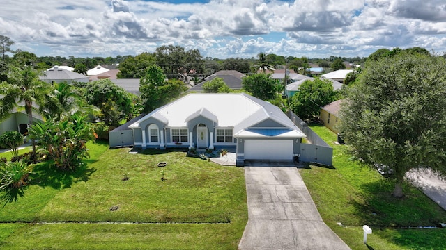 1226 SW San Antonio Ave, Port Saint Lucie, FL 34953 - view of front of property featuring driveway and a garage