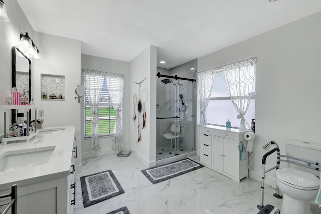 1226 SW San Antonio Ave, Port Saint Lucie, FL 34953 - full bathroom featuring baseboards, marble tiled flooring, a shower stall, toilet, and double vanity