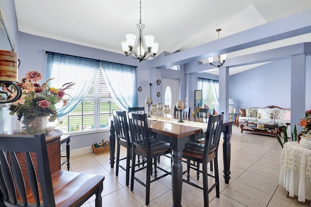 1226 SW San Antonio Ave, Port Saint Lucie, FL 34953 - dining space with a chandelier, light tile patterned floors, lofted ceiling, and baseboards