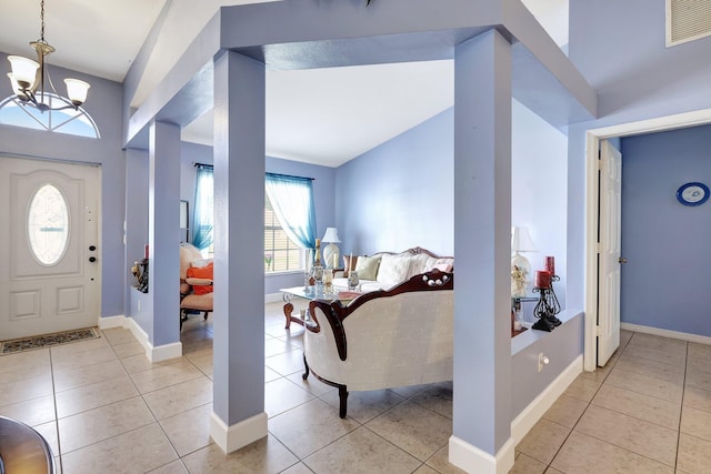 1226 SW San Antonio Ave, Port Saint Lucie, FL 34953 - entrance foyer with a chandelier, light tile patterned floors, and baseboards