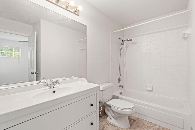 bathroom with toilet, vanity, and shower / washtub combination