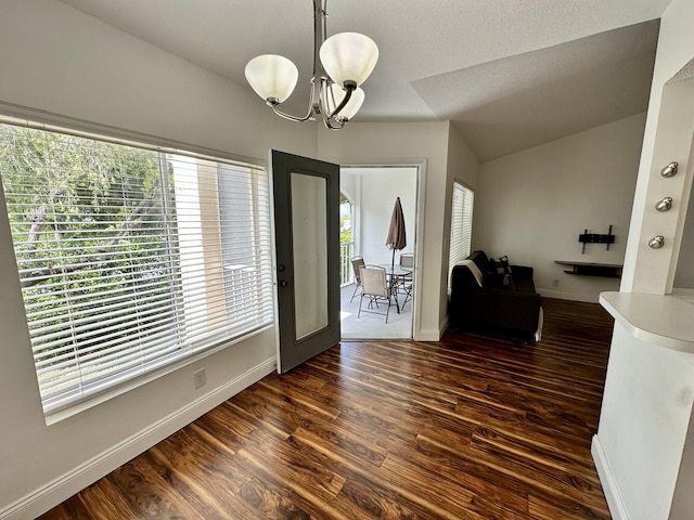 815 W Boynton Beach Blvd Unit 8-204, Boynton Beach, FL 33426 - dining room with a chandelier, dark wood-type flooring, and baseboards