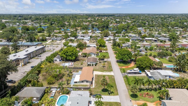 aerial view of property's location featuring nearby suburban area and a large body of water