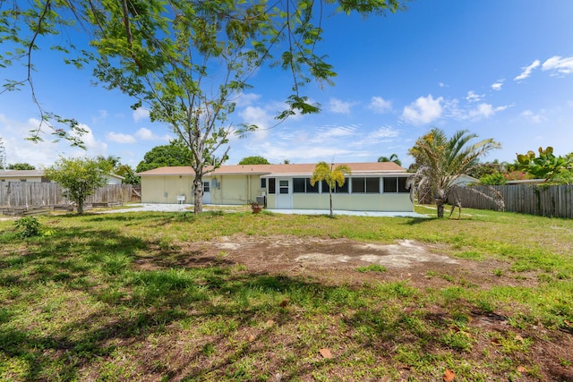 back of house with a sunroom