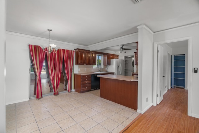 kitchen with black dishwasher, white fridge with ice dispenser, light countertops, ceiling fan, and crown molding