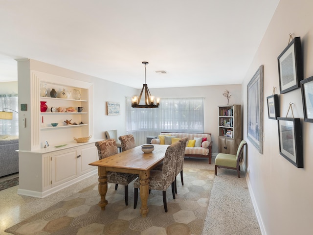 1001 N Lakeside Dr, Lake Worth Beach, FL 33460 - dining space with a chandelier, baseboards, and built in features
