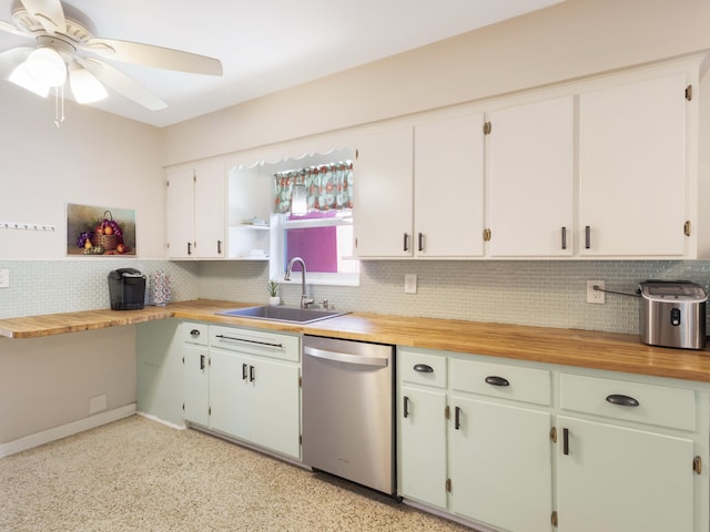1001 N Lakeside Dr, Lake Worth Beach, FL 33460 - kitchen featuring stainless steel dishwasher, a sink, ceiling fan, decorative backsplash, and butcher block counters