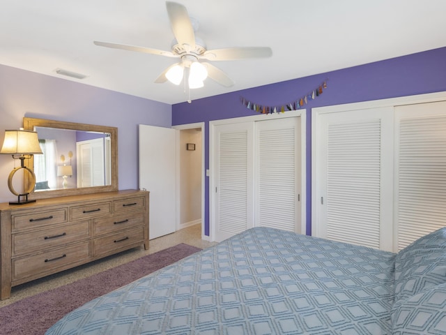 1001 N Lakeside Dr, Lake Worth Beach, FL 33460 - bedroom featuring two closets, light carpet, and ceiling fan