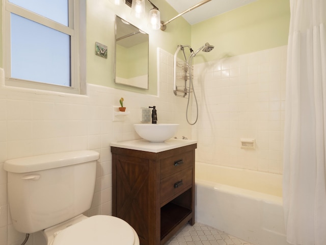 1001 N Lakeside Dr, Lake Worth Beach, FL 33460 - bathroom featuring tile walls, toilet, shower / bath combination with curtain, vanity, and tile patterned flooring