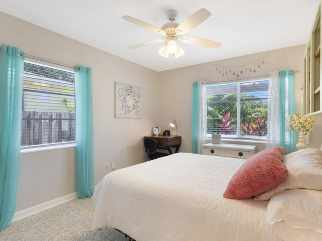 1001 N Lakeside Dr, Lake Worth Beach, FL 33460 - bedroom featuring baseboards, a ceiling fan, and light colored carpet