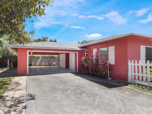 1001 N Lakeside Dr, Lake Worth Beach, FL 33460 - ranch-style house with stucco siding and concrete driveway