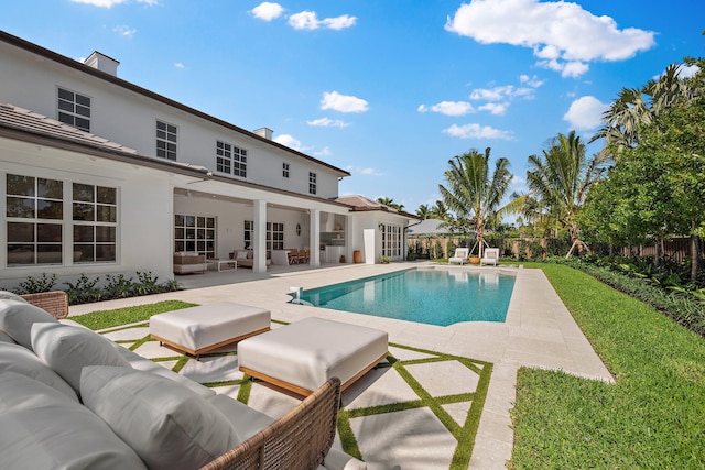 view of swimming pool featuring an outdoor living space, a patio area, and a fenced backyard