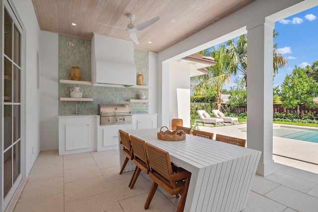 view of patio / terrace featuring ceiling fan, a sink, and outdoor dining area