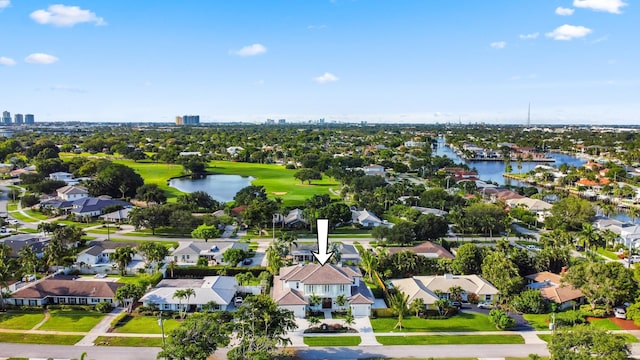 aerial perspective of suburban area with a large body of water and a golf course