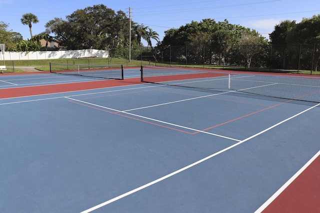 view of tennis court featuring community basketball court
