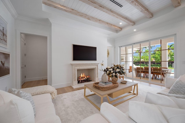 living area featuring wooden ceiling with exposed beams, light wood-style floors, a premium fireplace, recessed lighting, and baseboards