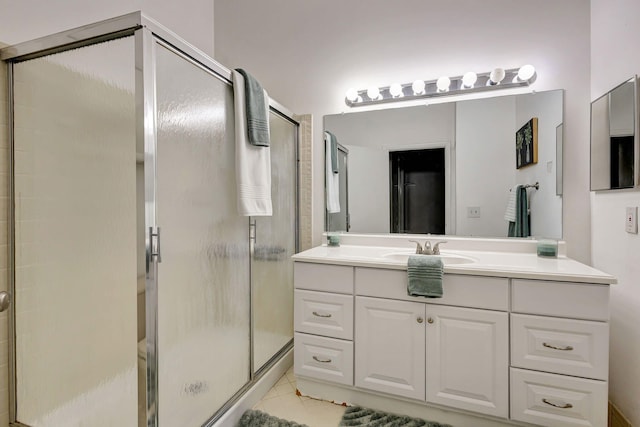 5450 Verona Dr Unit L, Boynton Beach, FL 33437 - bathroom featuring a stall shower, vanity, and tile patterned flooring