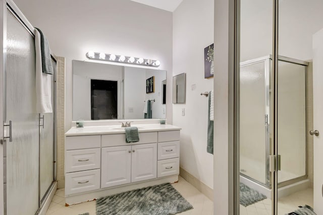 5450 Verona Dr Unit L, Boynton Beach, FL 33437 - bathroom with vanity, a stall shower, tile patterned flooring, and baseboards