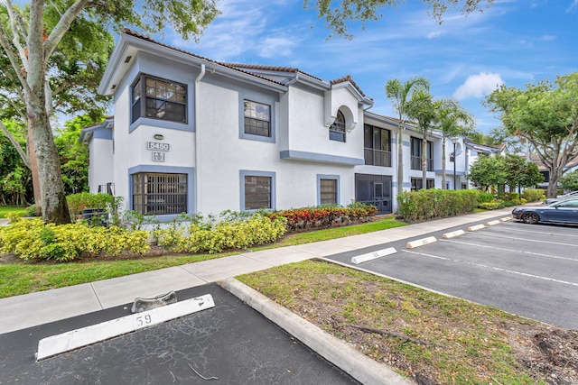 5450 Verona Dr Unit L, Boynton Beach, FL 33437 - view of property with uncovered parking