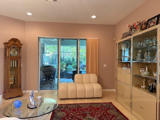 473 Cottagewood Ln, West Palm Beach, FL 33411 - living area with a textured ceiling, light wood-type flooring, baseboards, and recessed lighting