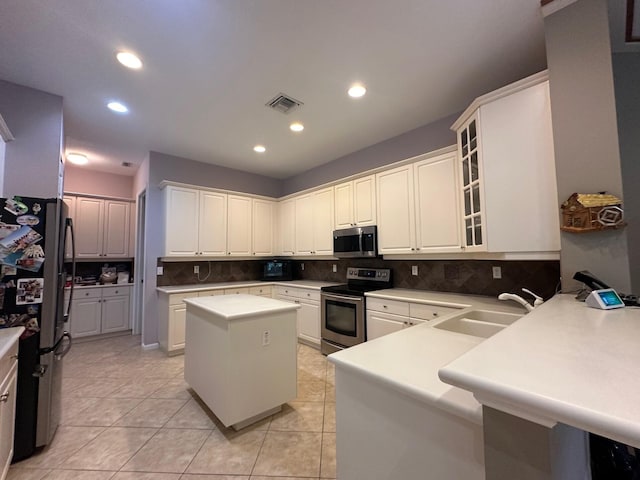 473 Cottagewood Ln, West Palm Beach, FL 33411 - kitchen featuring appliances with stainless steel finishes, a sink, backsplash, recessed lighting, and glass insert cabinets