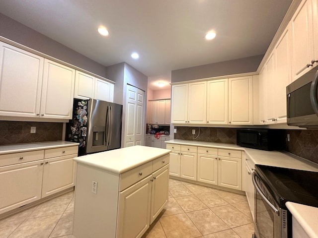 473 Cottagewood Ln, West Palm Beach, FL 33411 - kitchen featuring appliances with stainless steel finishes, decorative backsplash, light tile patterned floors, and recessed lighting