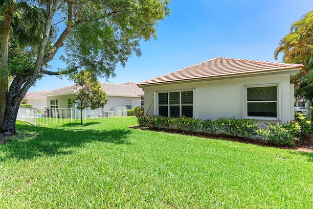 473 Cottagewood Ln, West Palm Beach, FL 33411 - rear view of house featuring stucco siding