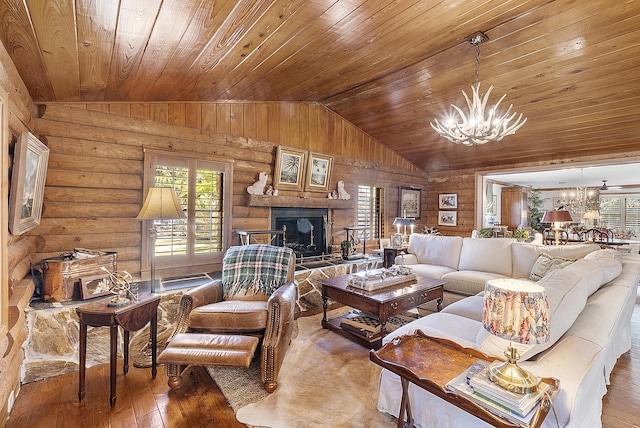32801 US Highway 441 N Unit 64, Okeechobee, FL 34972 - living room featuring a chandelier, lofted ceiling, wooden ceiling, plenty of natural light, and a fireplace with raised hearth
