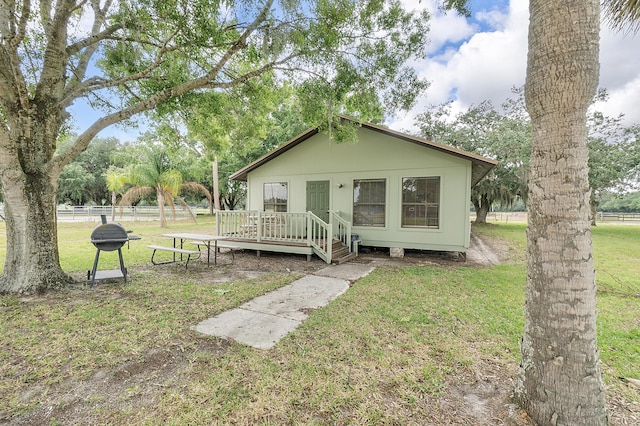 32801 US Highway 441 N Unit 64, Okeechobee, FL 34972 - bungalow-style house with a wooden deck