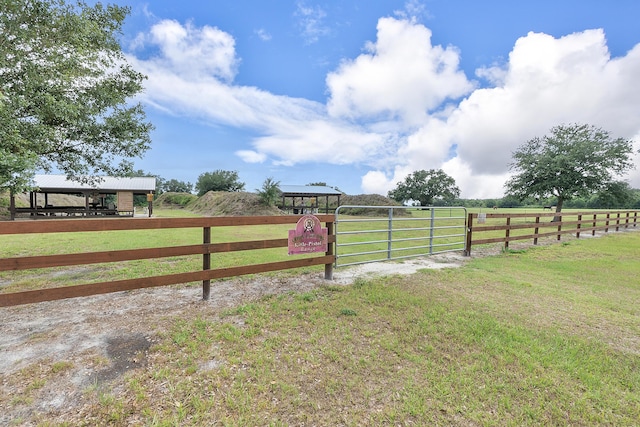 32801 US Highway 441 N Unit 64, Okeechobee, FL 34972 - view of yard featuring a rural view and a gate