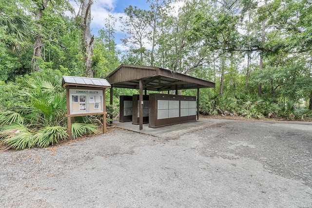 32801 US Highway 441 N Unit 64, Okeechobee, FL 34972 - view of car parking with mail area and a detached carport