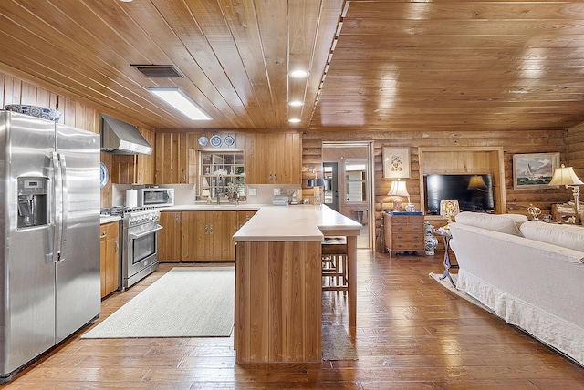 32801 US Highway 441 N Unit 64, Okeechobee, FL 34972 - kitchen featuring appliances with stainless steel finishes, wooden ceiling, a peninsula, wall chimney exhaust hood, and light countertops