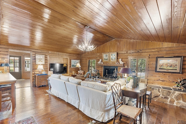 32801 US Highway 441 N Unit 64, Okeechobee, FL 34972 - living room with wooden ceiling, vaulted ceiling, hardwood / wood-style floors, a chandelier, and a fireplace