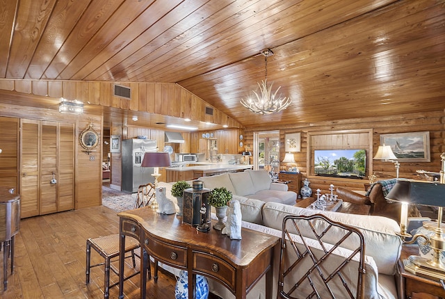 32801 US Highway 441 N Unit 64, Okeechobee, FL 34972 - living area with wood ceiling, a chandelier, light wood-type flooring, rustic walls, and vaulted ceiling