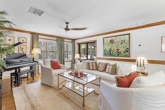 32801 US Highway 441 N Unit 64, Okeechobee, FL 34972 - living area featuring crown molding, wood finished floors, a ceiling fan, and baseboards