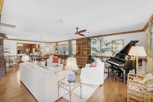 32801 US Highway 441 N Unit 64, Okeechobee, FL 34972 - living area featuring ornamental molding, ceiling fan, light wood finished floors, and a chandelier
