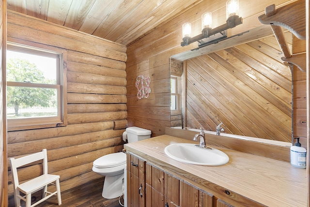 32801 US Highway 441 N Unit 64, Okeechobee, FL 34972 - bathroom featuring toilet, rustic walls, vanity, wood ceiling, and wood-type flooring