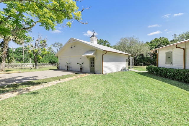 32801 US Highway 441 N Unit 64, Okeechobee, FL 34972 - view of property exterior with a garage and a chimney
