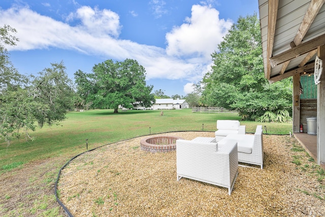 32801 US Highway 441 N Unit 64, Okeechobee, FL 34972 - view of green lawn featuring a fire pit