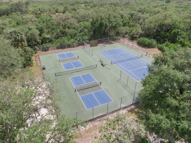 32801 US Highway 441 N Unit 64, Okeechobee, FL 34972 - view of tennis court featuring a view of trees and fence