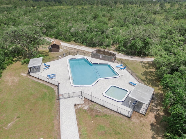 32801 US Highway 441 N Unit 64, Okeechobee, FL 34972 - community pool featuring a forest view