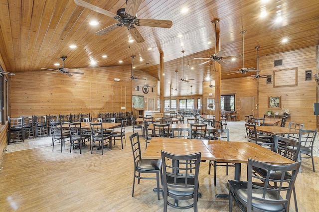 32801 US Highway 441 N Unit 64, Okeechobee, FL 34972 - dining space with a ceiling fan, wood walls, wooden ceiling, and light wood-style flooring